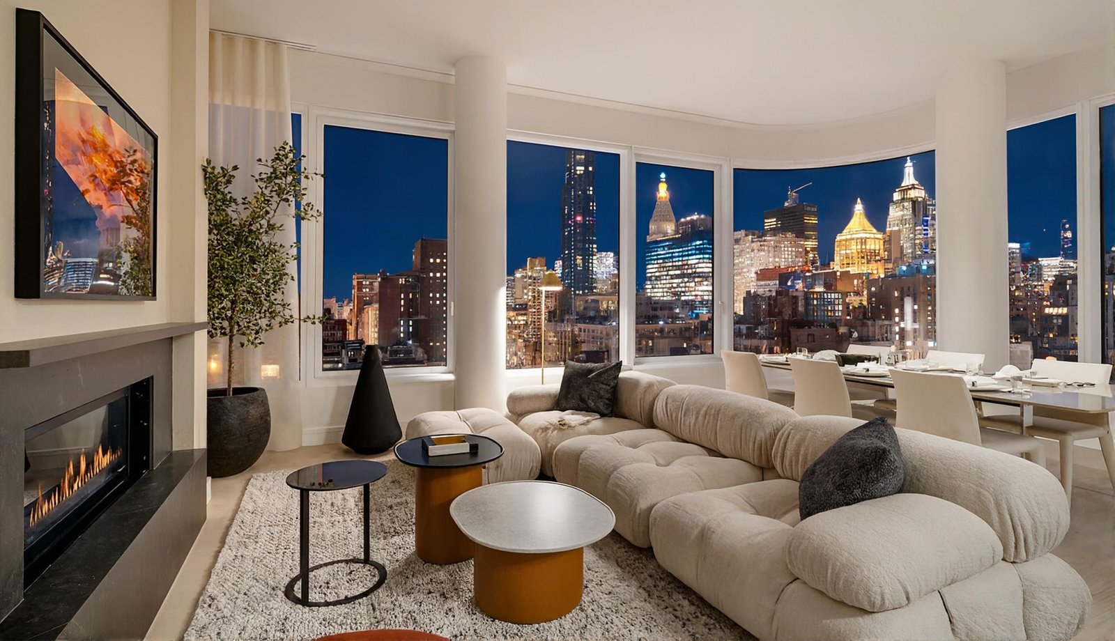 200 East 20th Street #PHA, Gramercy Park, New York. Living room with fireplace and skyline views at night, represented by Frederico Gouveia